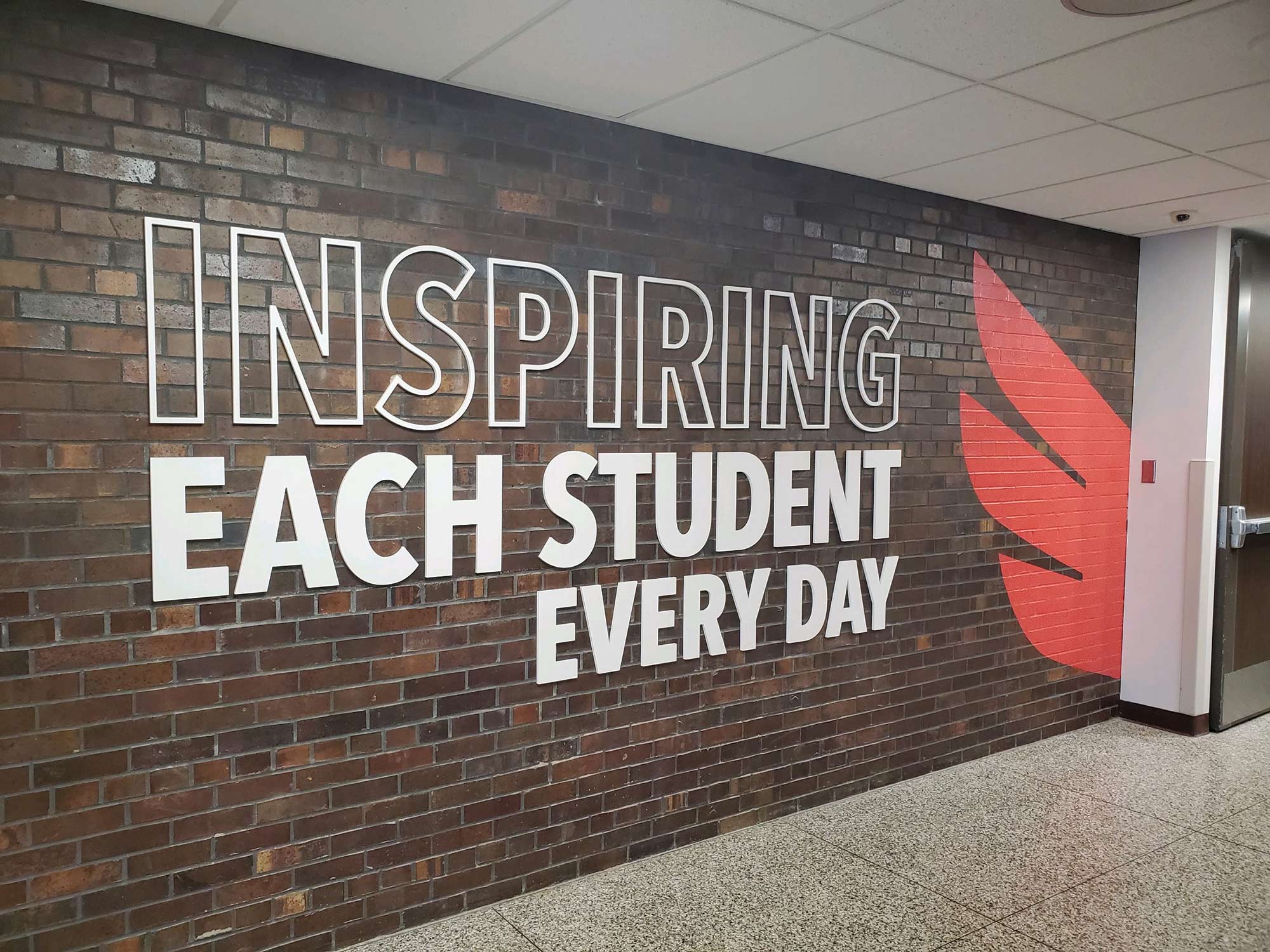 Inspiring Each Student Every Day wall graphic at Forest Hills Elementary